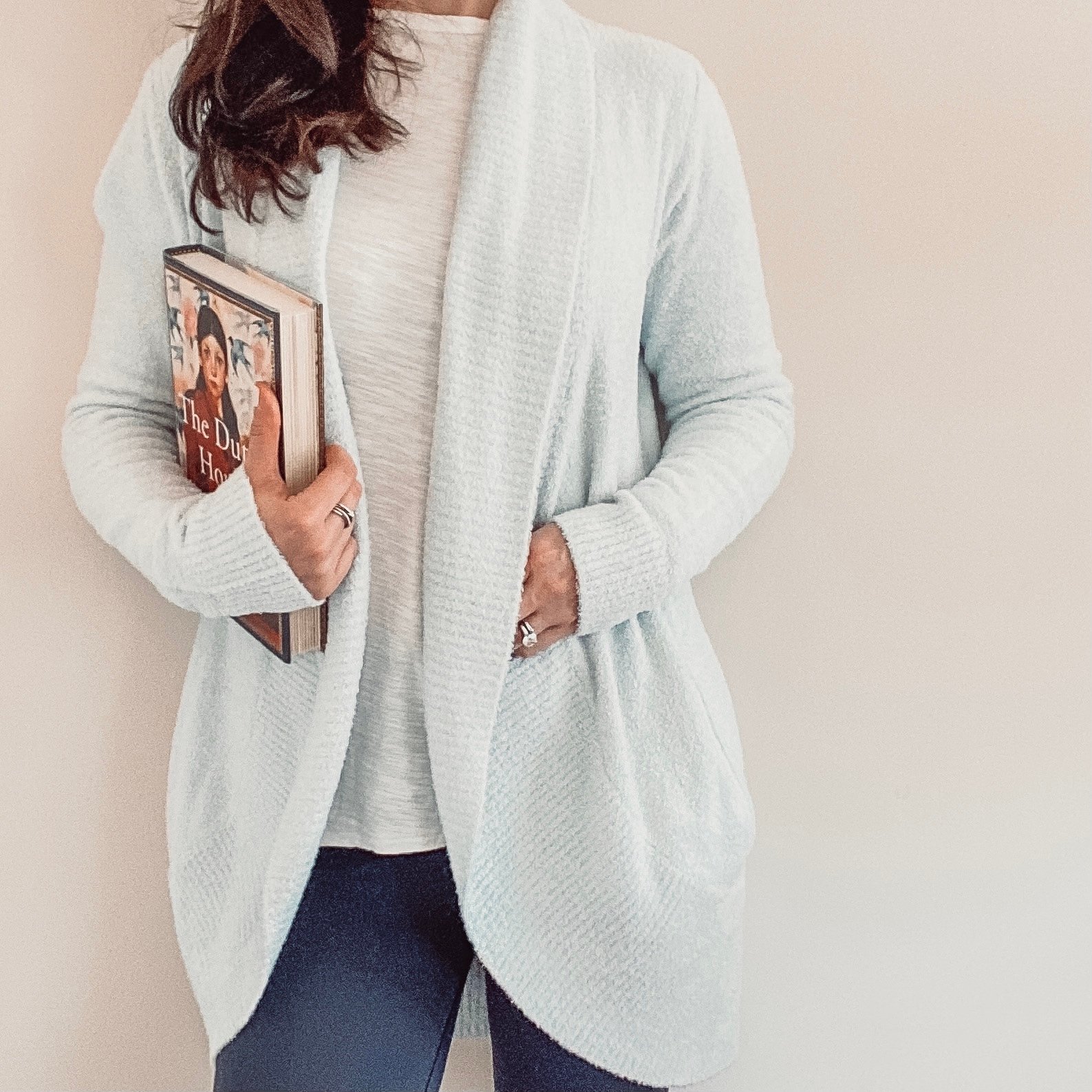 Barefoot Dreams cardigan sweater and book