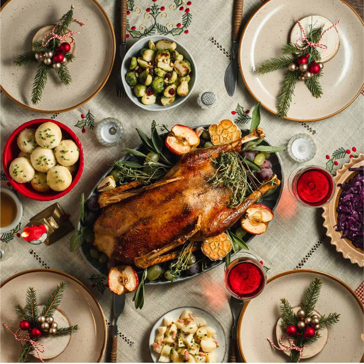 overhead table shot of a traditional American Christmas dinner table with food.