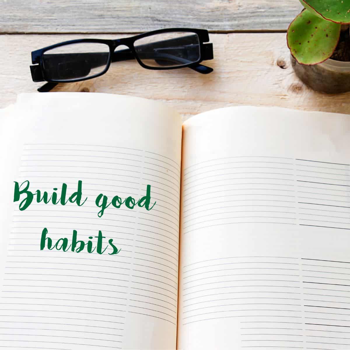 "build good habits" written on a book