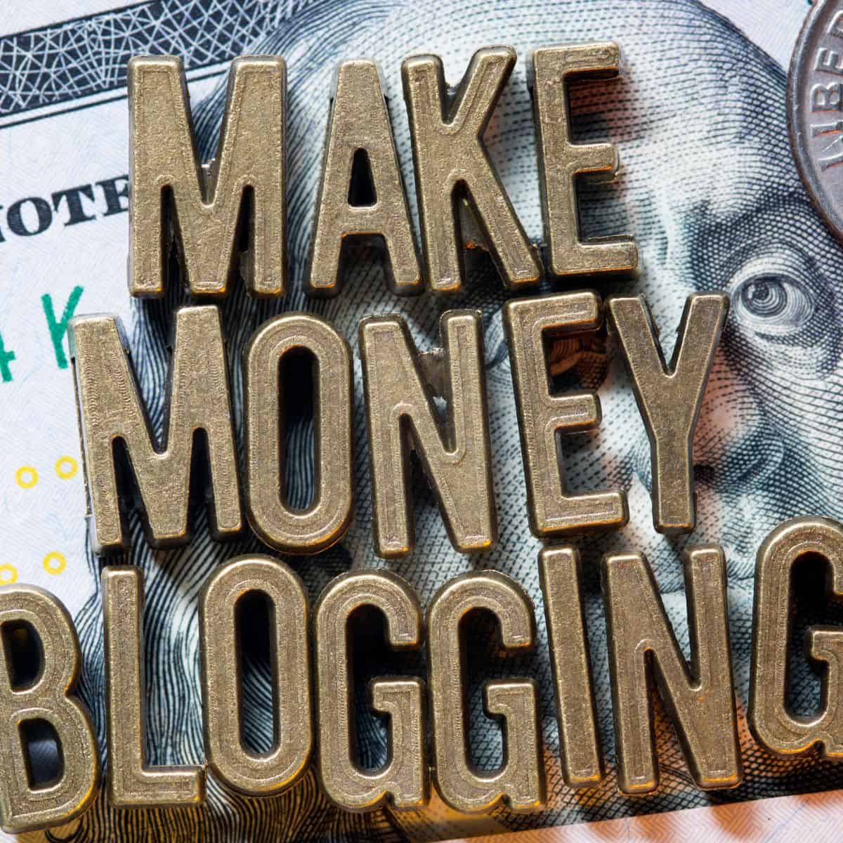 the words make money blogging on top of money