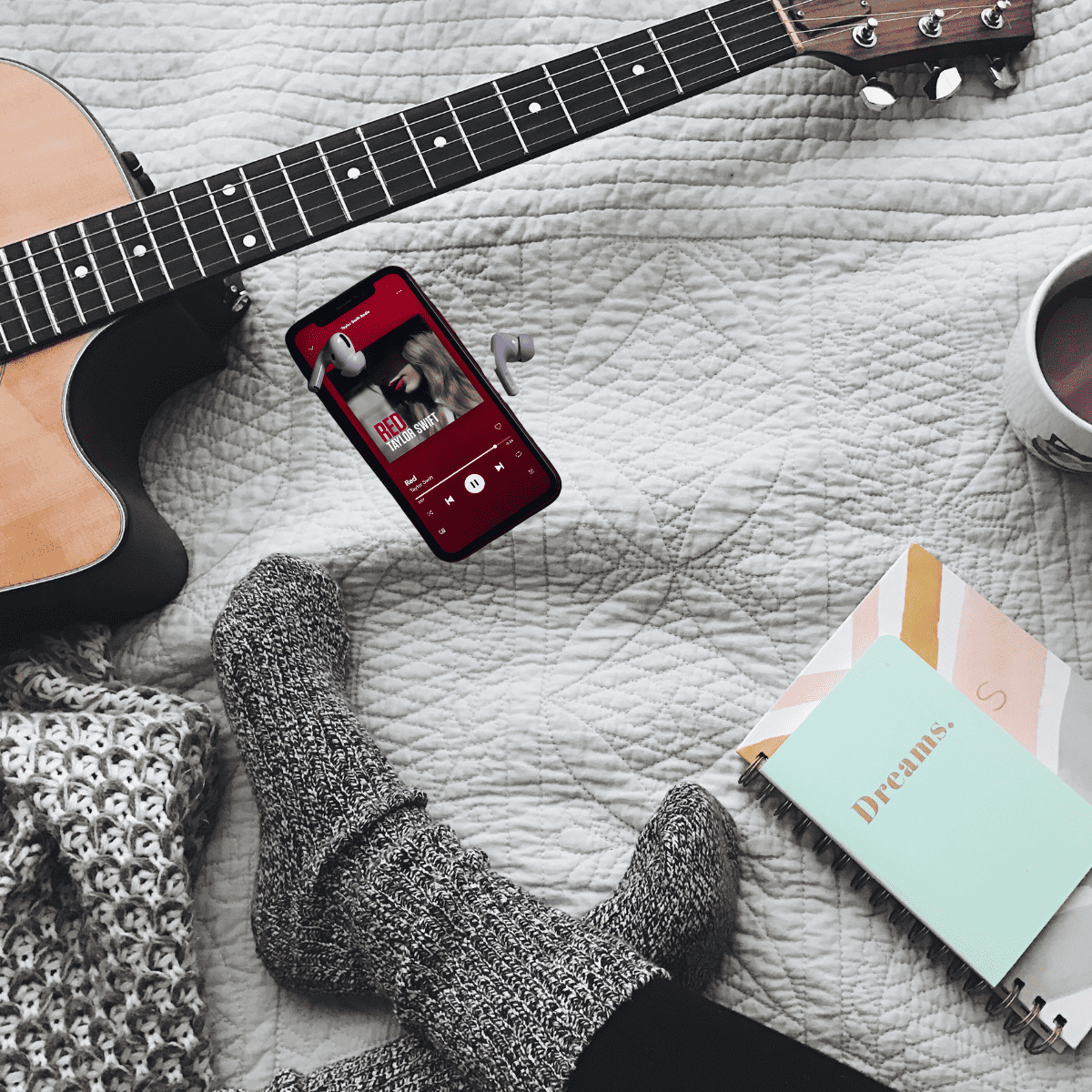 guitar, socks, books, coffee, and taylor swift music on iphone
