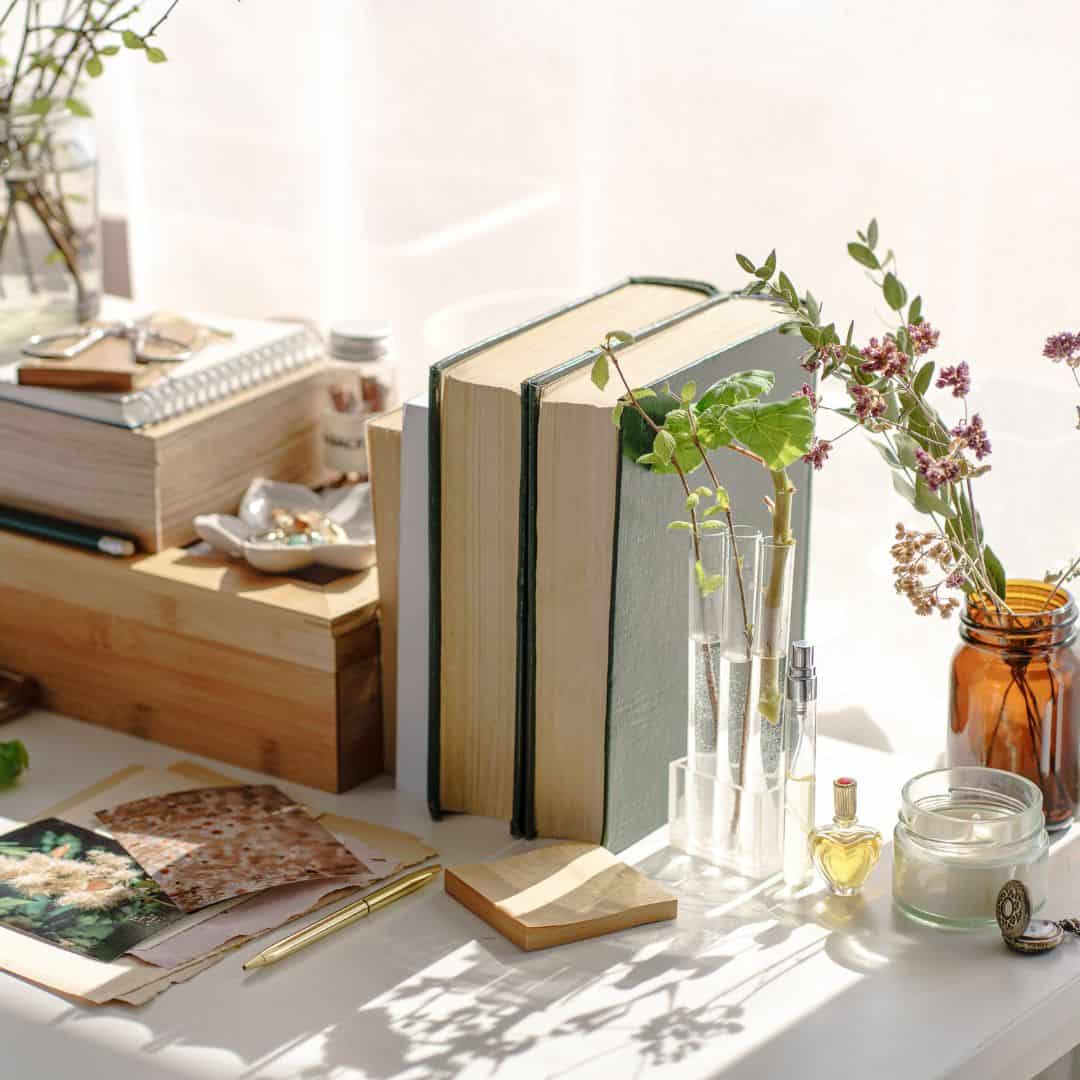 books with desk accessories and sunlight pouring in