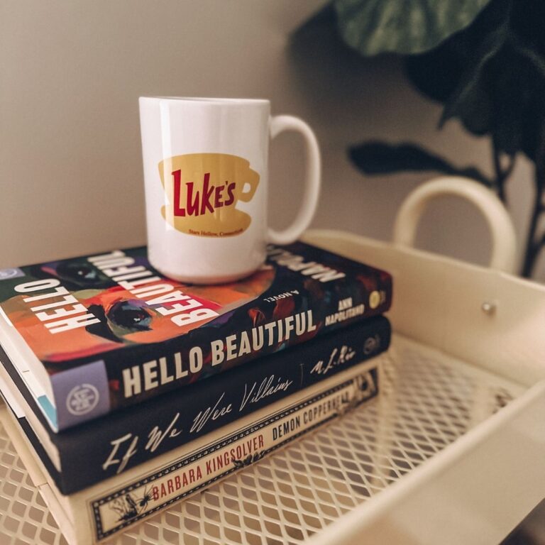 luke's diner mug with books: hello beautiful, if we were villains, and demon copperhead.