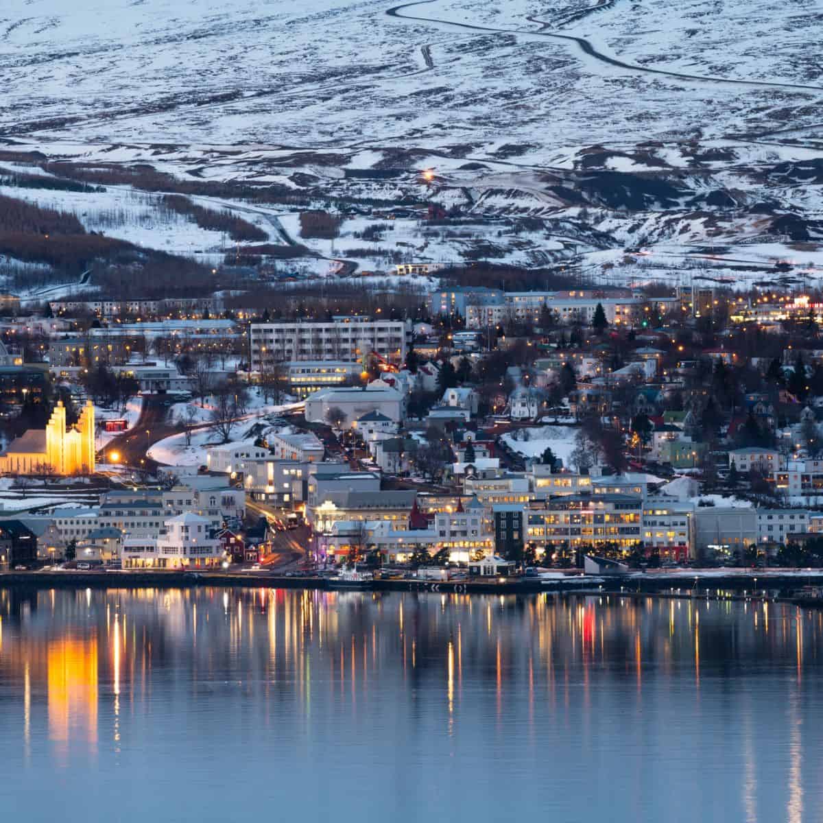 snowy landscape of a town in Iceland at Christmastime.