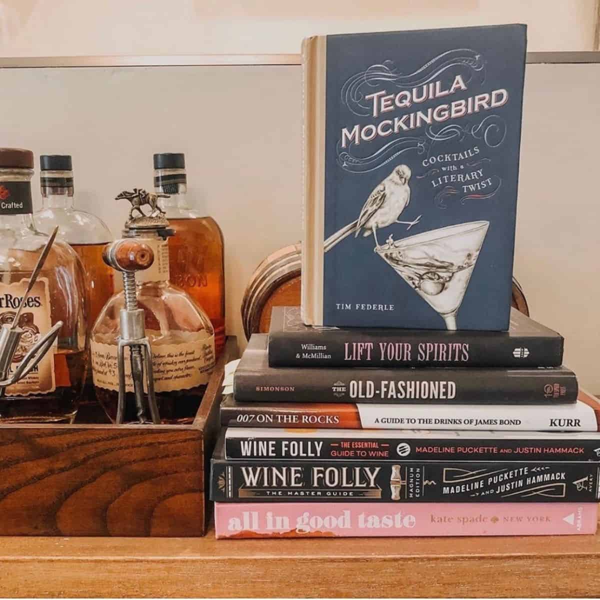 wine and cocktail books on a bar.