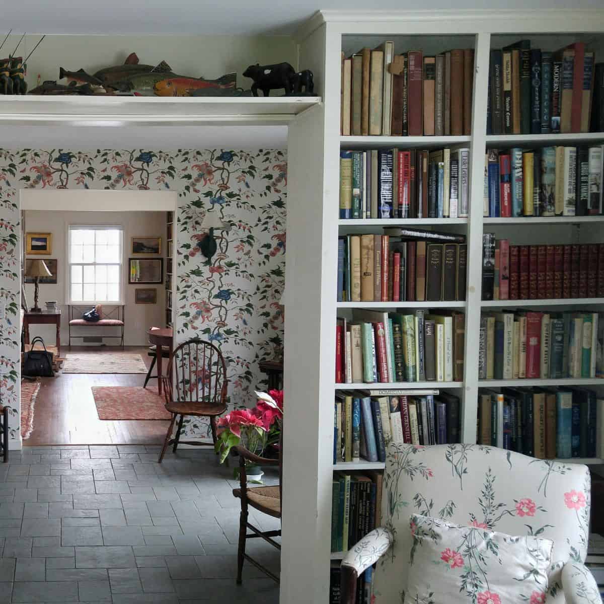 bookshelves and chair in front of a foyer.