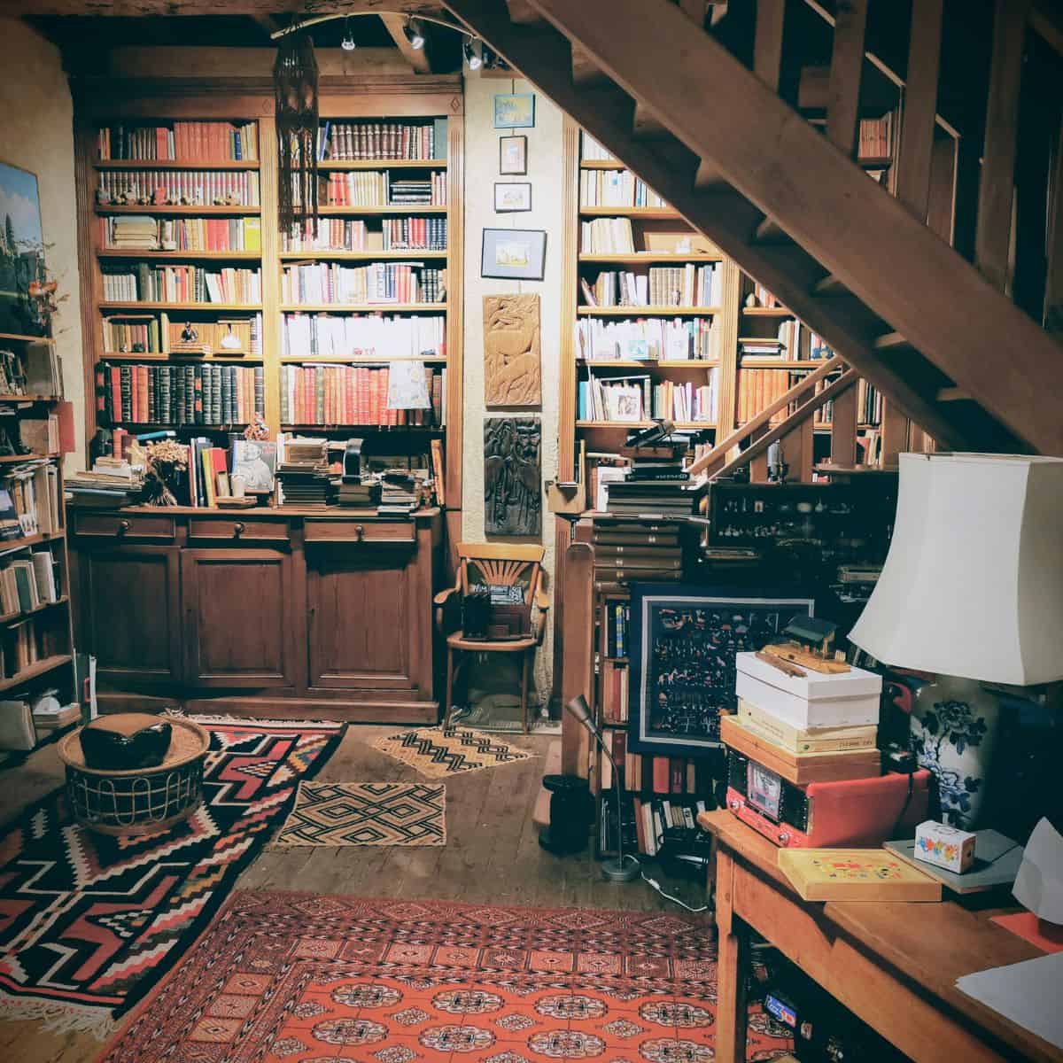 bookshelves under a staircase.